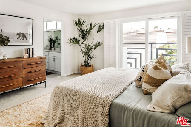 carpeted bedroom featuring connected bathroom