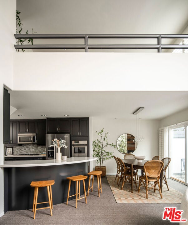 dining room with light carpet