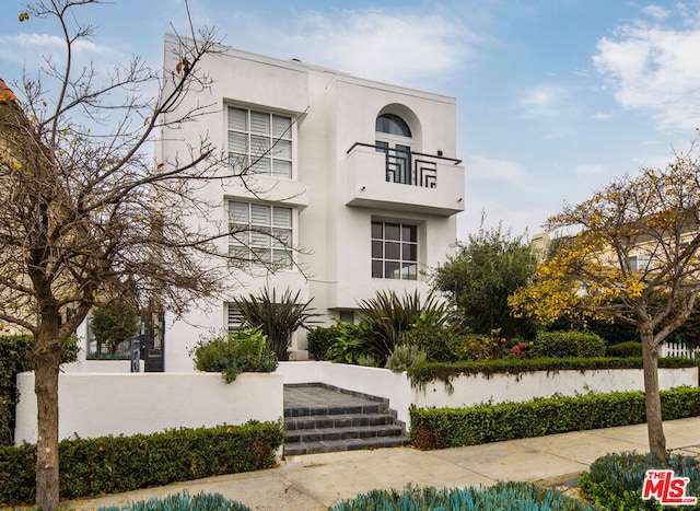 art deco house featuring a balcony