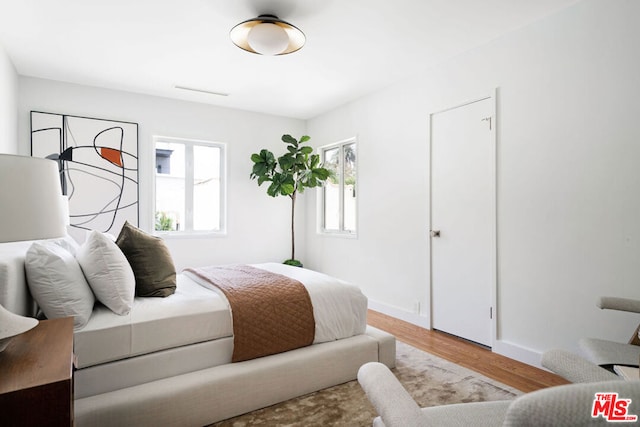 bedroom with light hardwood / wood-style floors