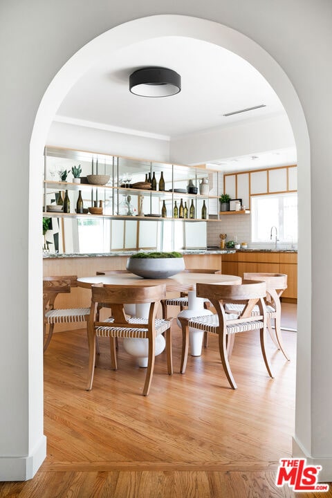 dining area featuring light hardwood / wood-style flooring and sink