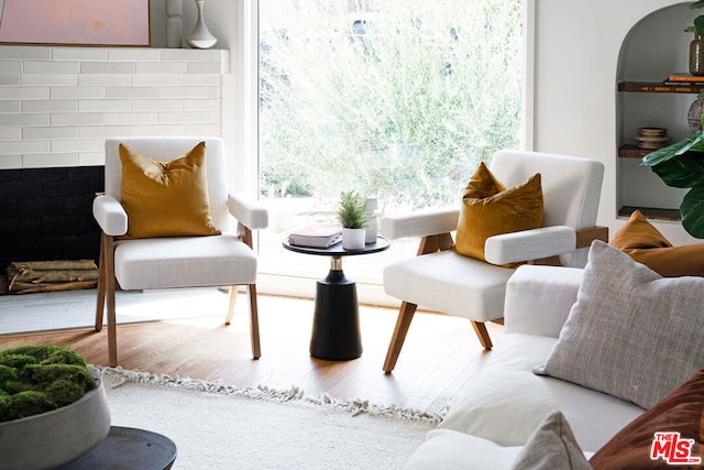 sitting room with wood-type flooring