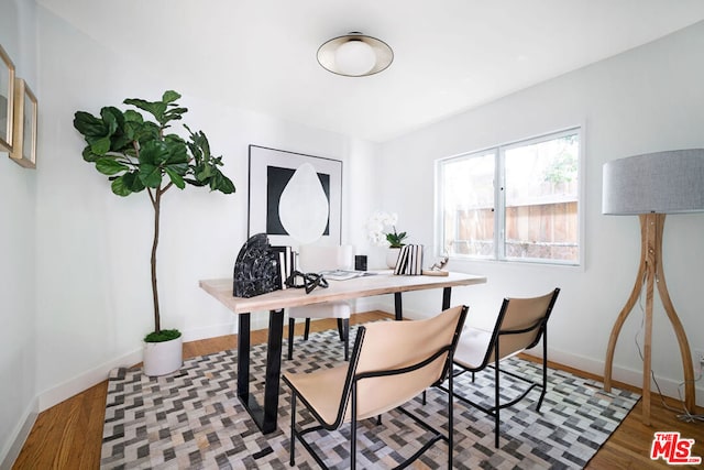 home office with hardwood / wood-style flooring