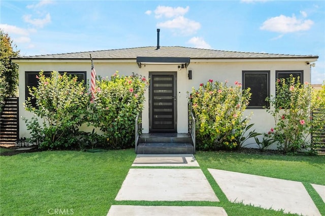 view of front of home with a front yard