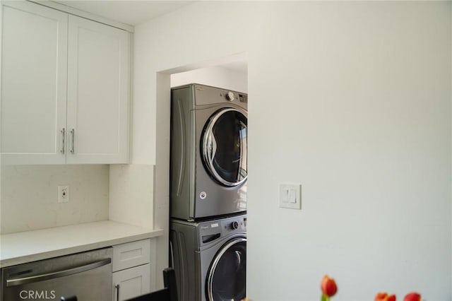 laundry room with stacked washer and dryer