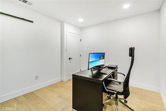 home office featuring light hardwood / wood-style floors