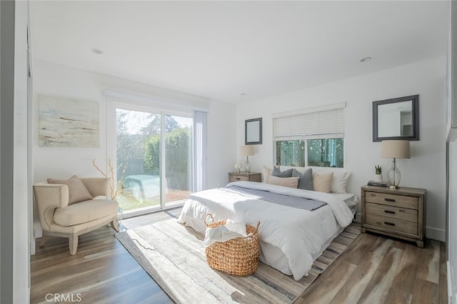 bedroom featuring access to outside and wood-type flooring