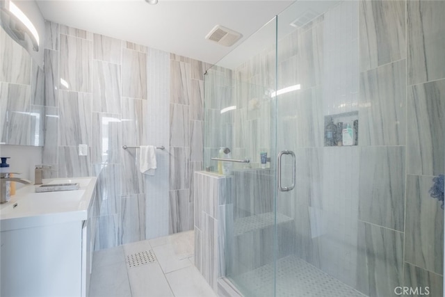 bathroom with vanity and an enclosed shower