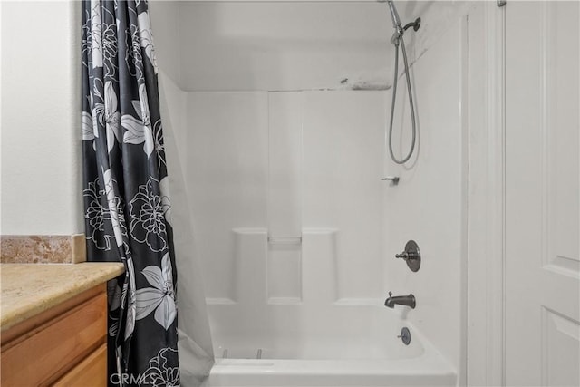 bathroom with vanity and shower / tub combo with curtain