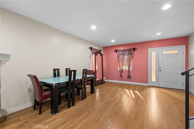 dining space with light hardwood / wood-style flooring