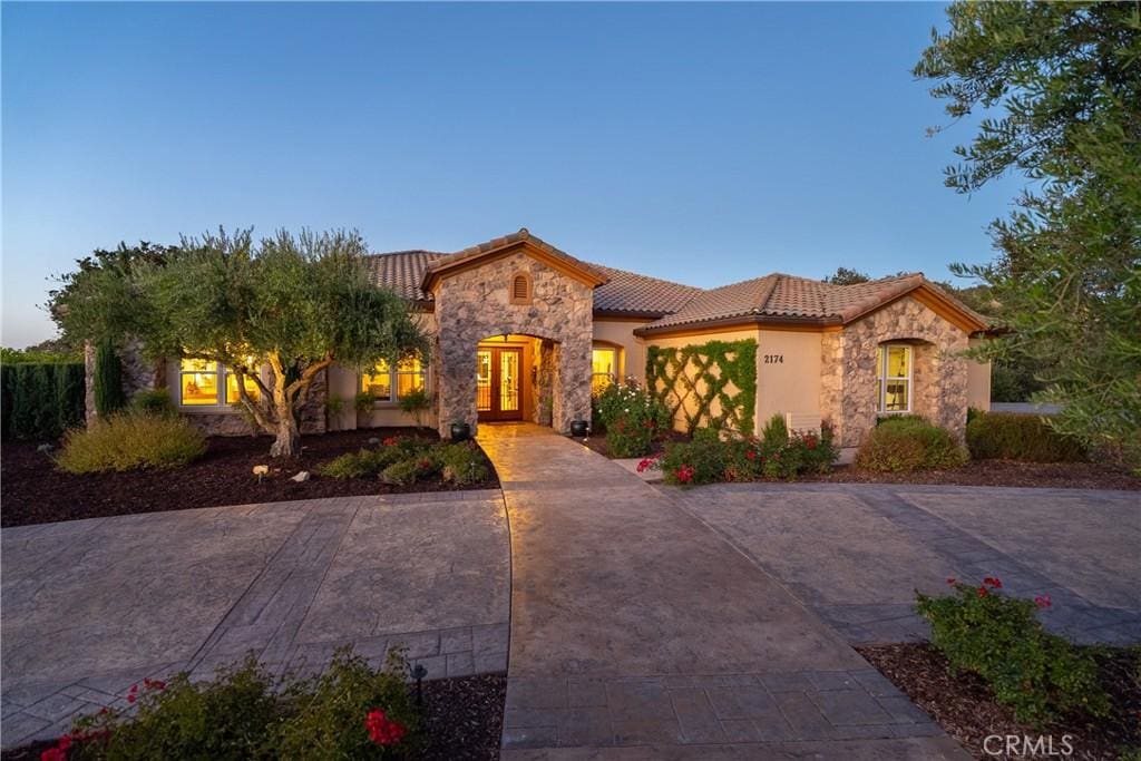 mediterranean / spanish house featuring french doors