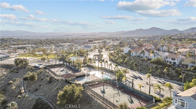 birds eye view of property with a mountain view