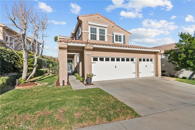 mediterranean / spanish-style home featuring a tiled roof, a front yard, stucco siding, driveway, and an attached garage