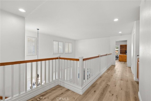 hall with light hardwood / wood-style flooring