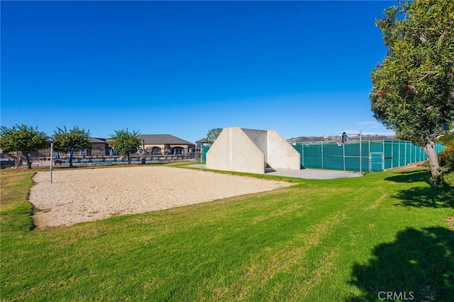 view of property's community featuring volleyball court and a lawn