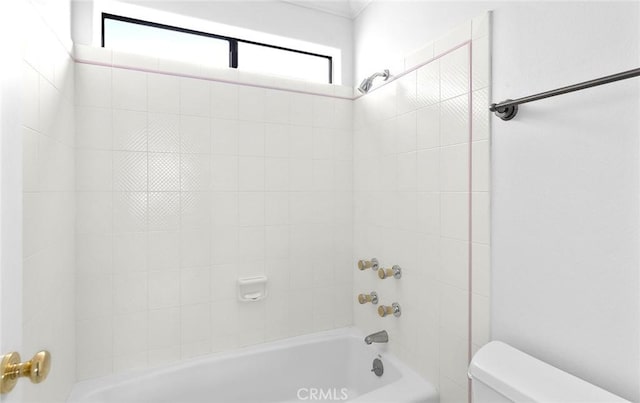 bathroom featuring toilet and tub / shower combination