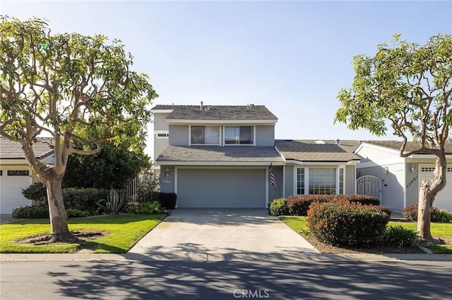 view of front facade with a front lawn and a garage