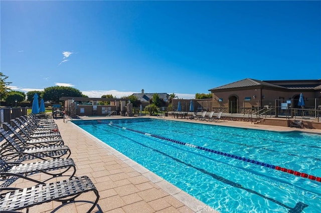 view of swimming pool featuring a patio