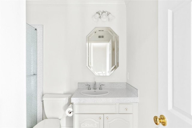 bathroom featuring vanity and toilet