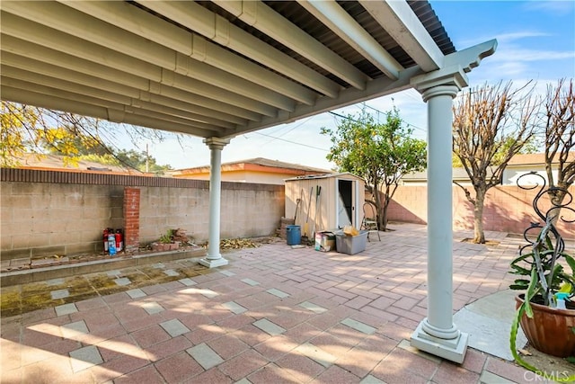 view of patio with a storage unit