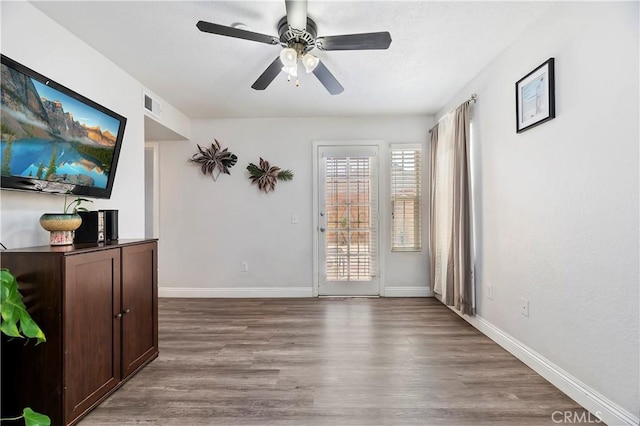 interior space featuring light hardwood / wood-style flooring and ceiling fan