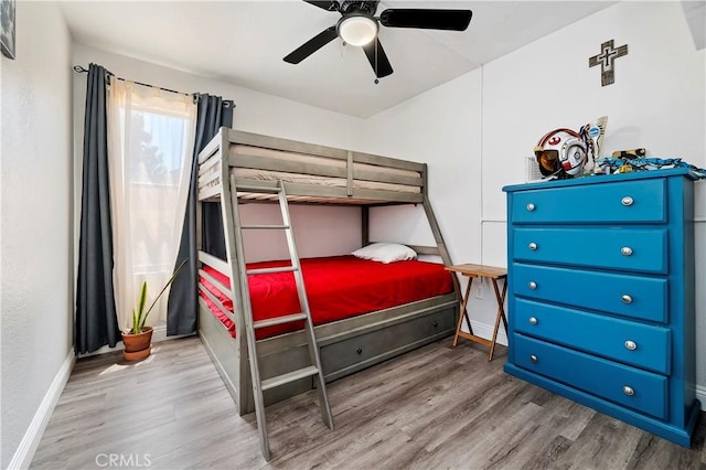 bedroom featuring hardwood / wood-style flooring and ceiling fan