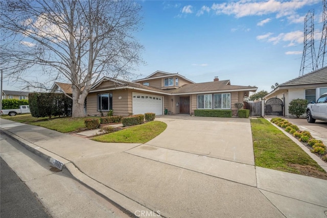 view of front facade featuring a garage and a front lawn