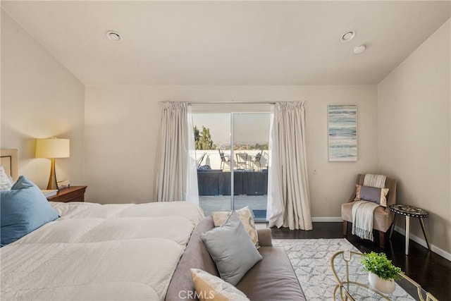 bedroom featuring access to outside and hardwood / wood-style floors