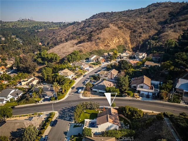 birds eye view of property featuring a mountain view