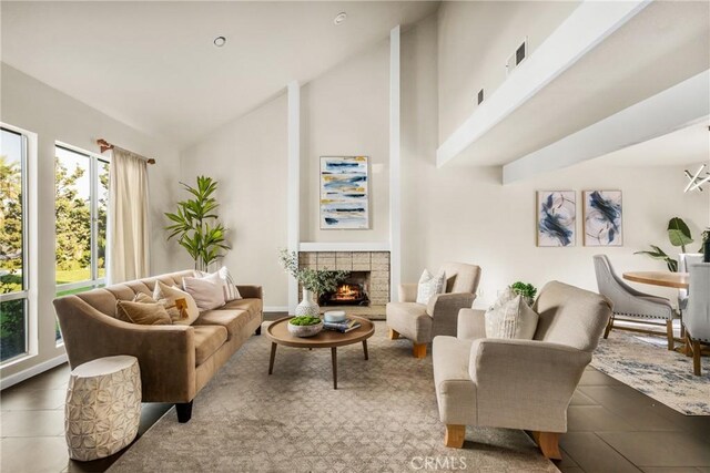 tiled living room with a fireplace and high vaulted ceiling