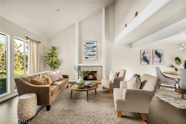 living room featuring tile patterned flooring, a fireplace, and high vaulted ceiling