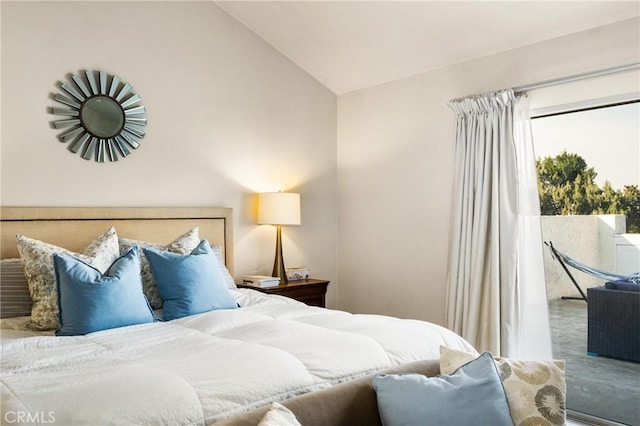 bedroom with lofted ceiling