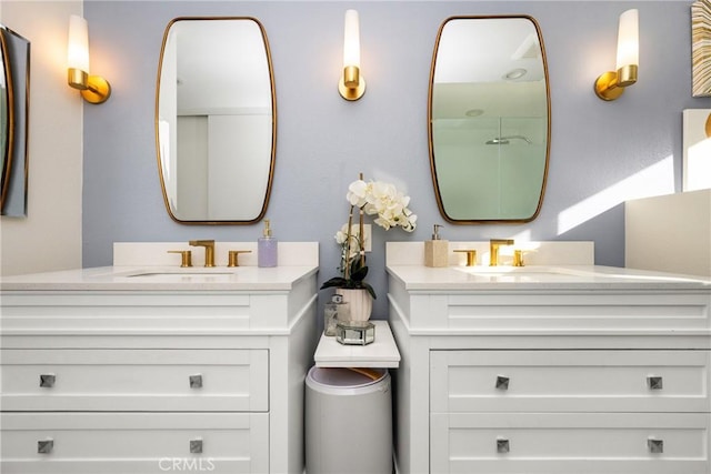 full bath featuring two vanities and a sink