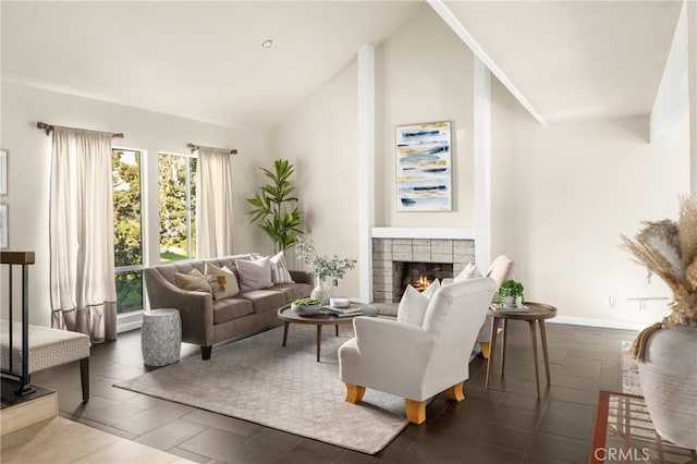 living room with lofted ceiling, baseboards, and a lit fireplace