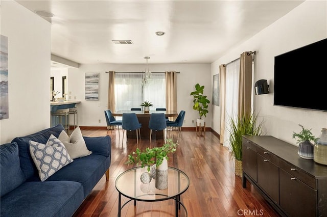 living room featuring dark hardwood / wood-style flooring