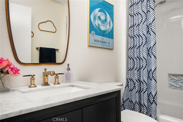 bathroom with shower / bath combo, toilet, and vanity