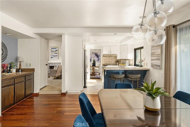 dining space featuring dark wood-type flooring