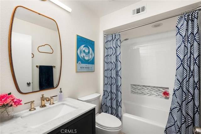 bathroom featuring shower / bath combo, visible vents, vanity, and toilet