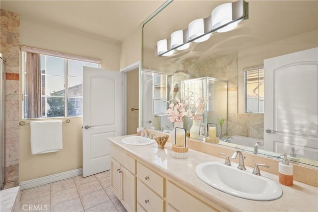 bathroom with tile patterned floors, vanity, and shower with separate bathtub