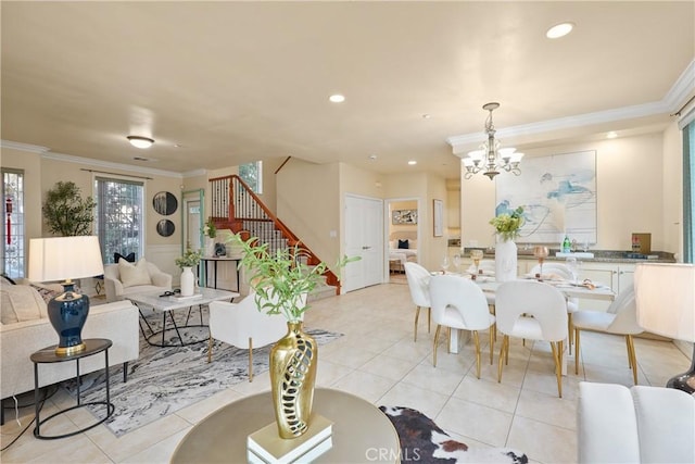 tiled dining area featuring crown molding and an inviting chandelier