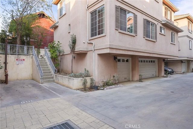 view of side of property featuring a garage