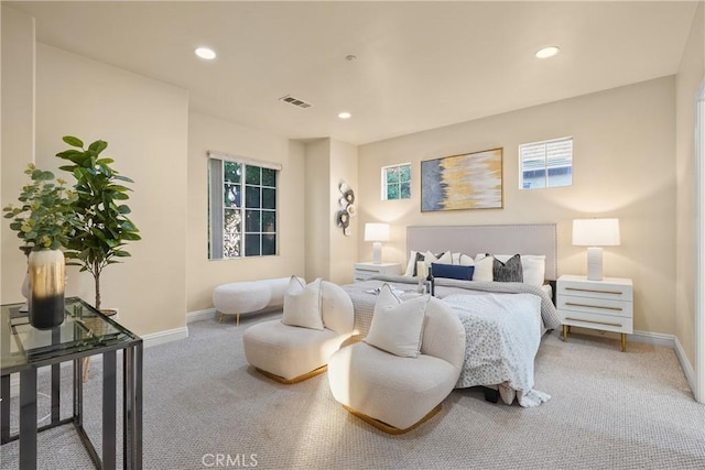 bedroom with multiple windows and carpet flooring