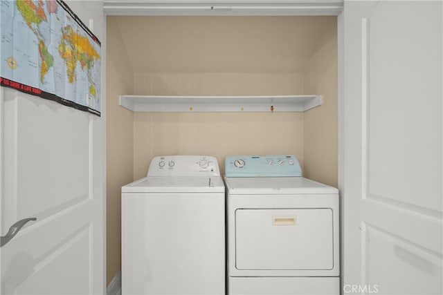 laundry area featuring washing machine and clothes dryer