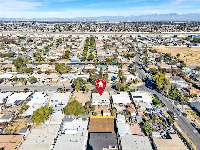 birds eye view of property with a residential view and a mountain view