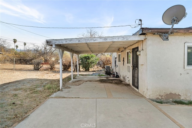 exterior space featuring a carport