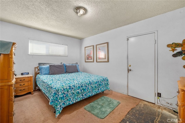 1538 W 15th St, San Bernardino, CA 92411 - bedroom featuring light carpet and a textured ceiling