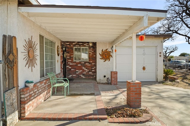 view of patio featuring a garage