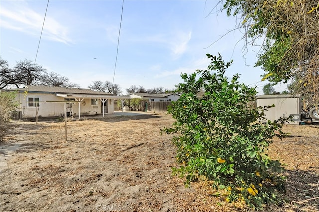 1538 W 15th St, San Bernardino, CA 92411 - view of yard featuring a patio area, fence, and an outdoor structure