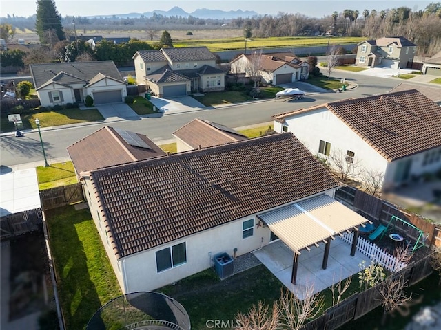 birds eye view of property featuring a mountain view