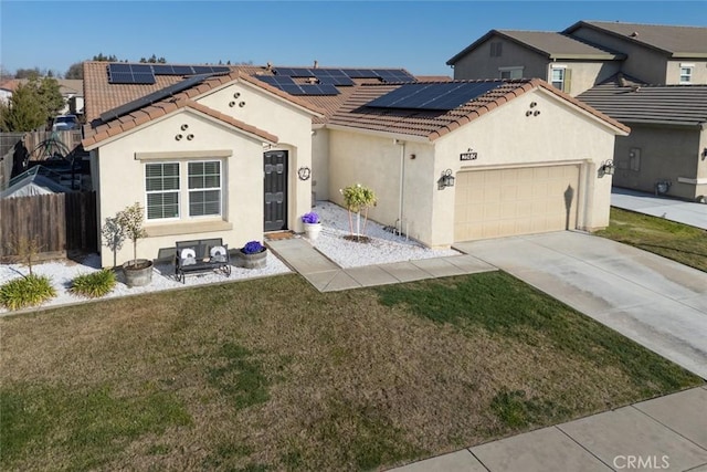 view of front of property with a front yard, a garage, and solar panels